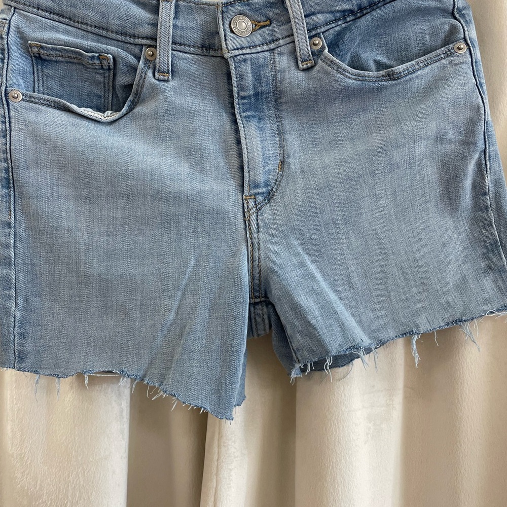 Levi's Light Blue Raw Hem Denim Shorts